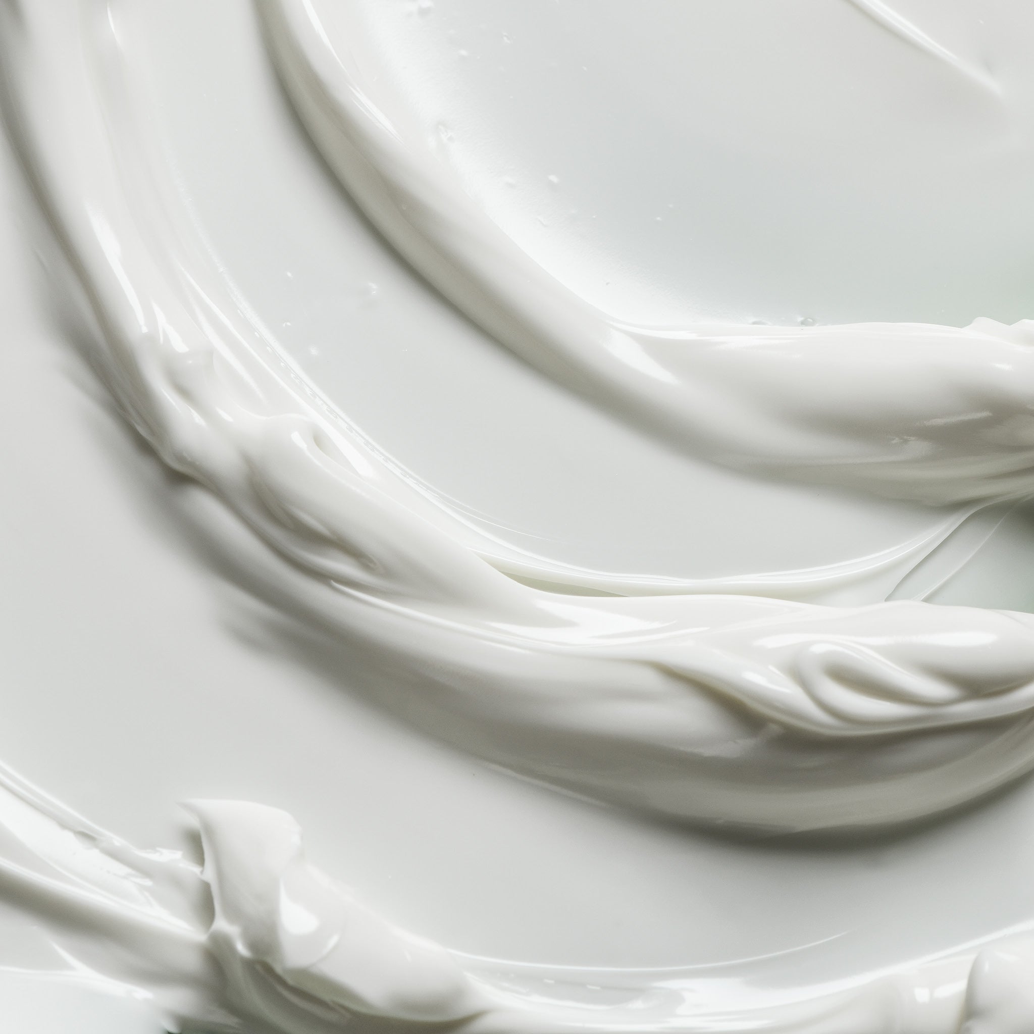 Experience the smooth, lightweight feel of Alivio Nourishing Day Cream. Image shows a close-up of the cream's texture.
